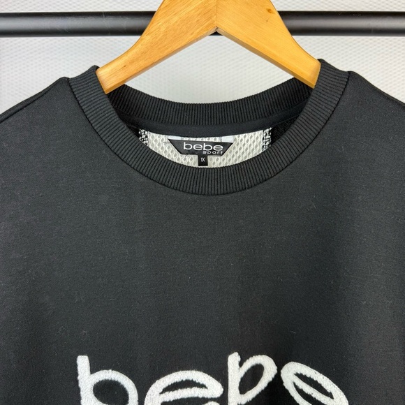 NEW Bebe Plus sport black short sleeve with sport patch woman’s shirt Size 1X - Picture 2 of 6
